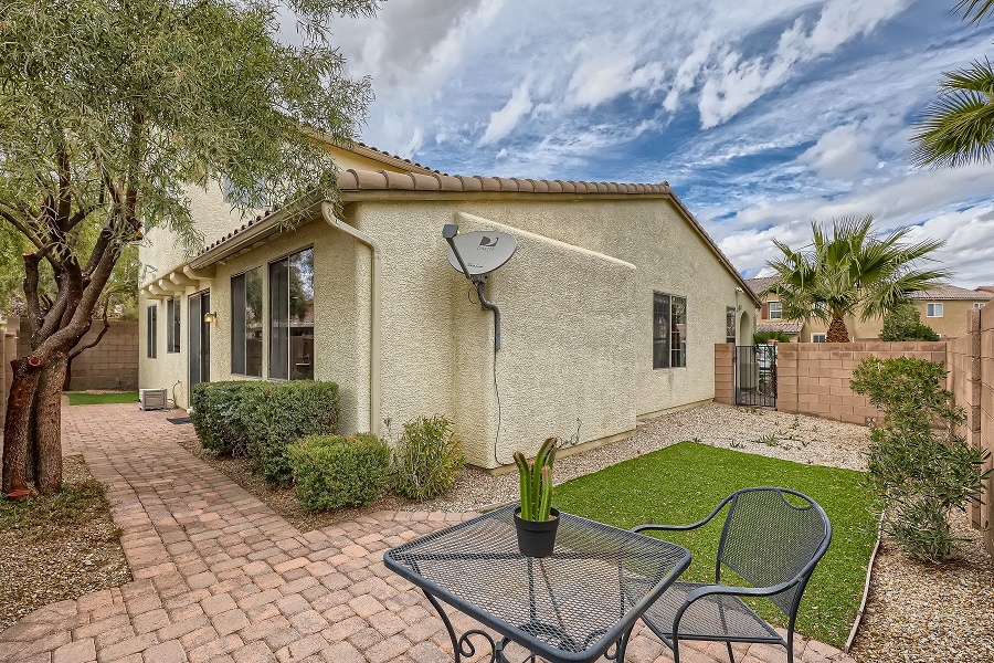 2-story, single family home is located in Centennial Hills and includes a master suite downstairs. 